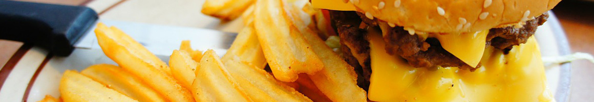 Eating American (New) Burger at Floradora Saloon restaurant in Telluride, CO.